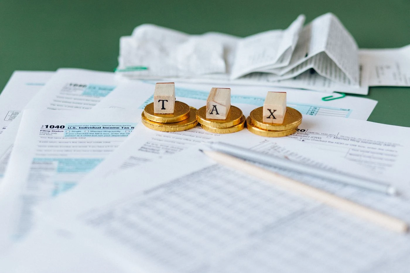 Tax documents and 1040 forms on a desk
